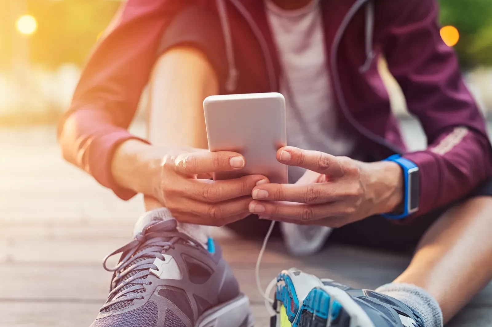 Sporty woman using a workout app on her mobile phone