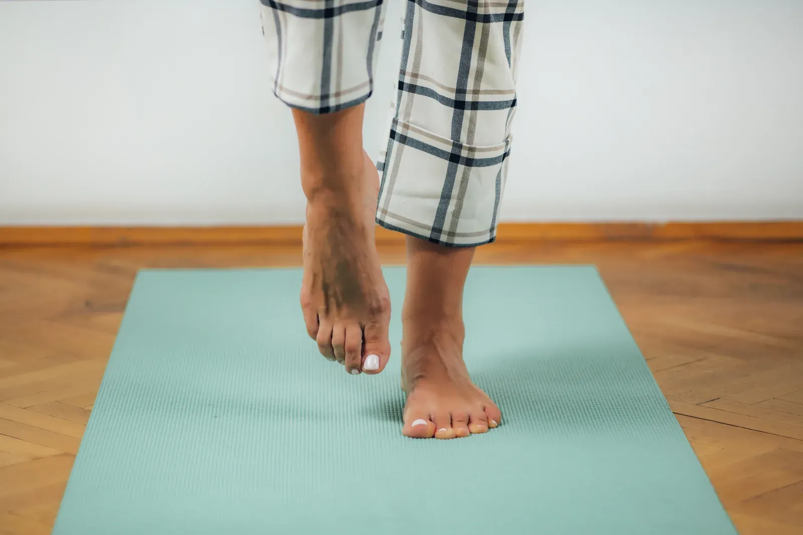 Holding a single leg stance during a one leg balance test