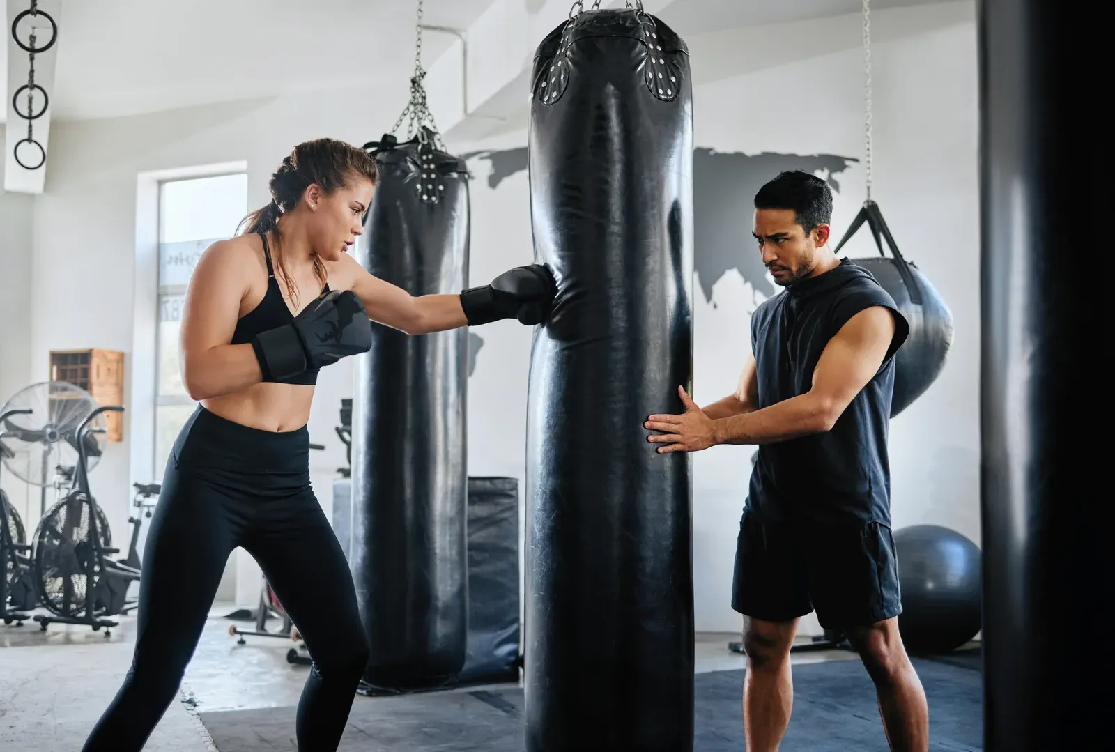 A man shadowboxing at high intensity during a conditioning workout