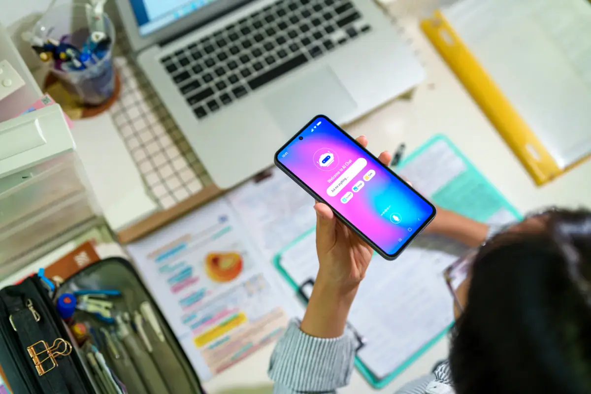 Person typing questions into an AI chatbot on a computer screen