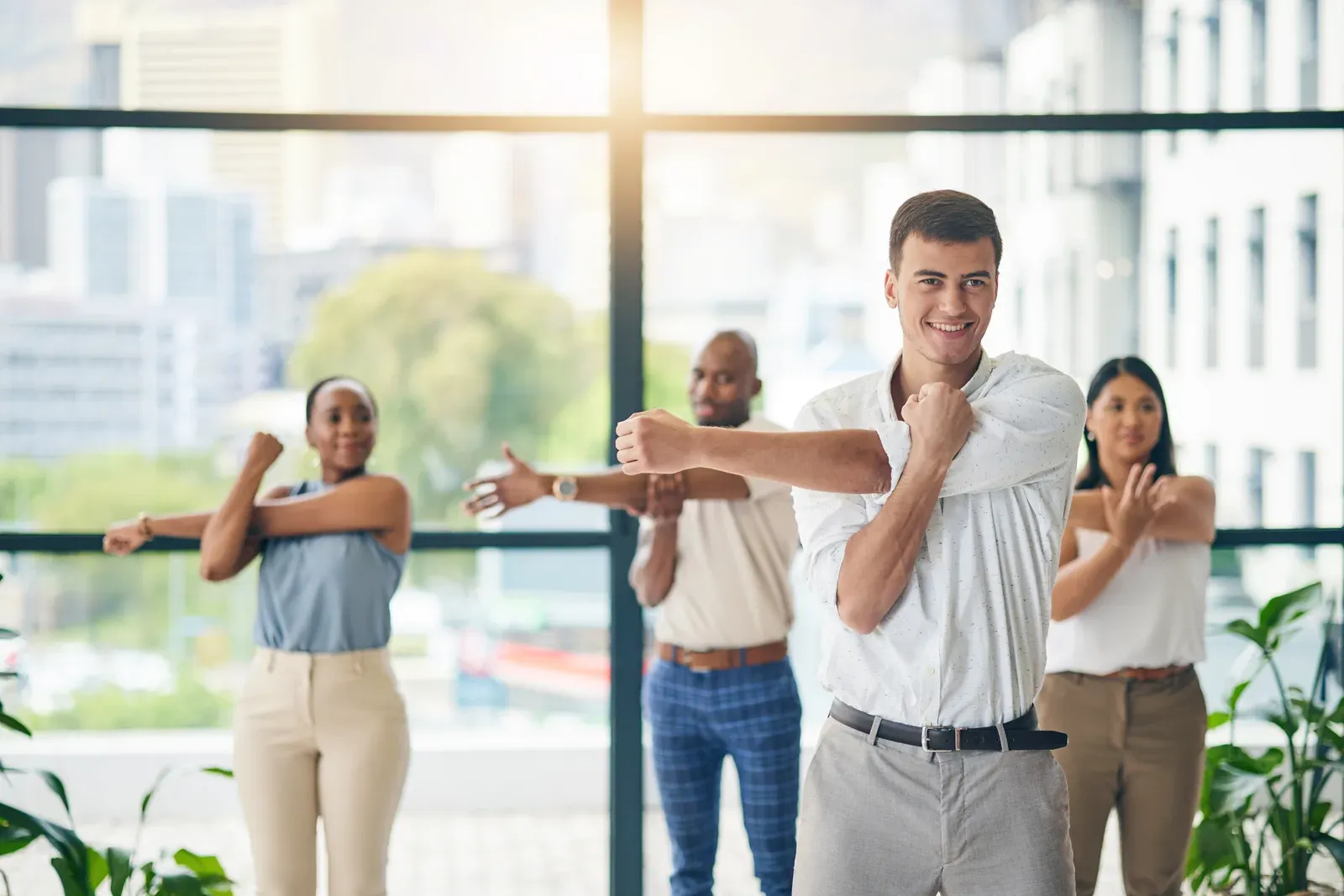 Coworkers in athletic wear finishing a training session together