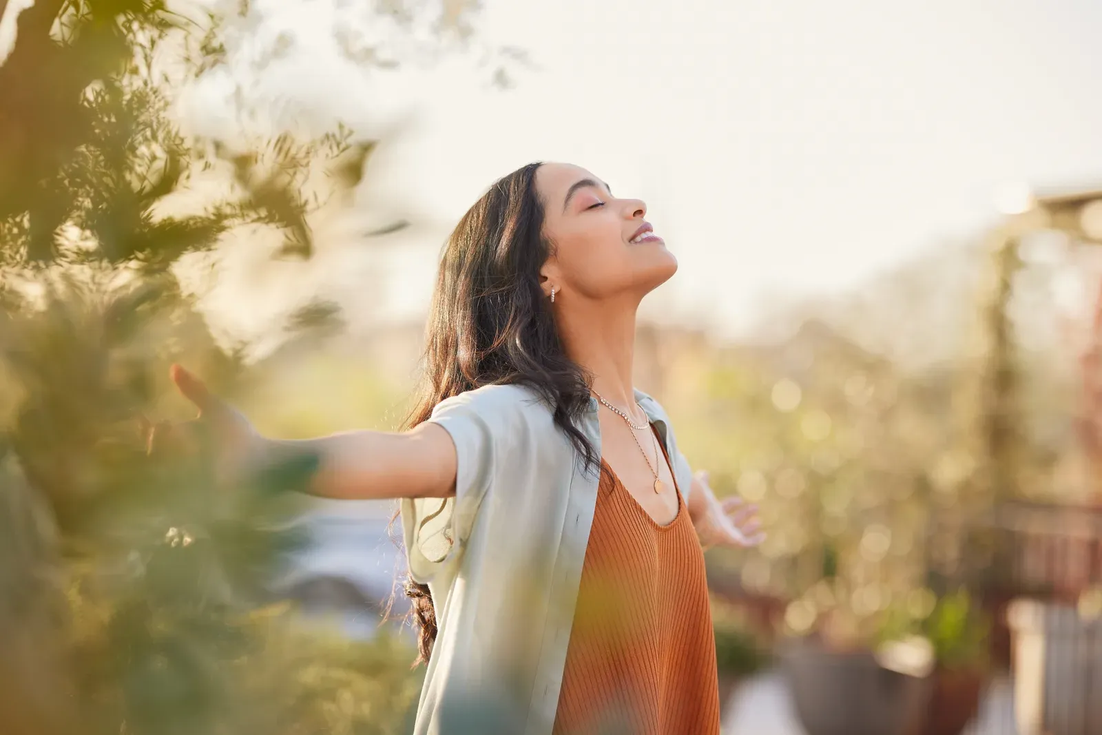 Serene woman enjoying a calm sunset moment of stress relief