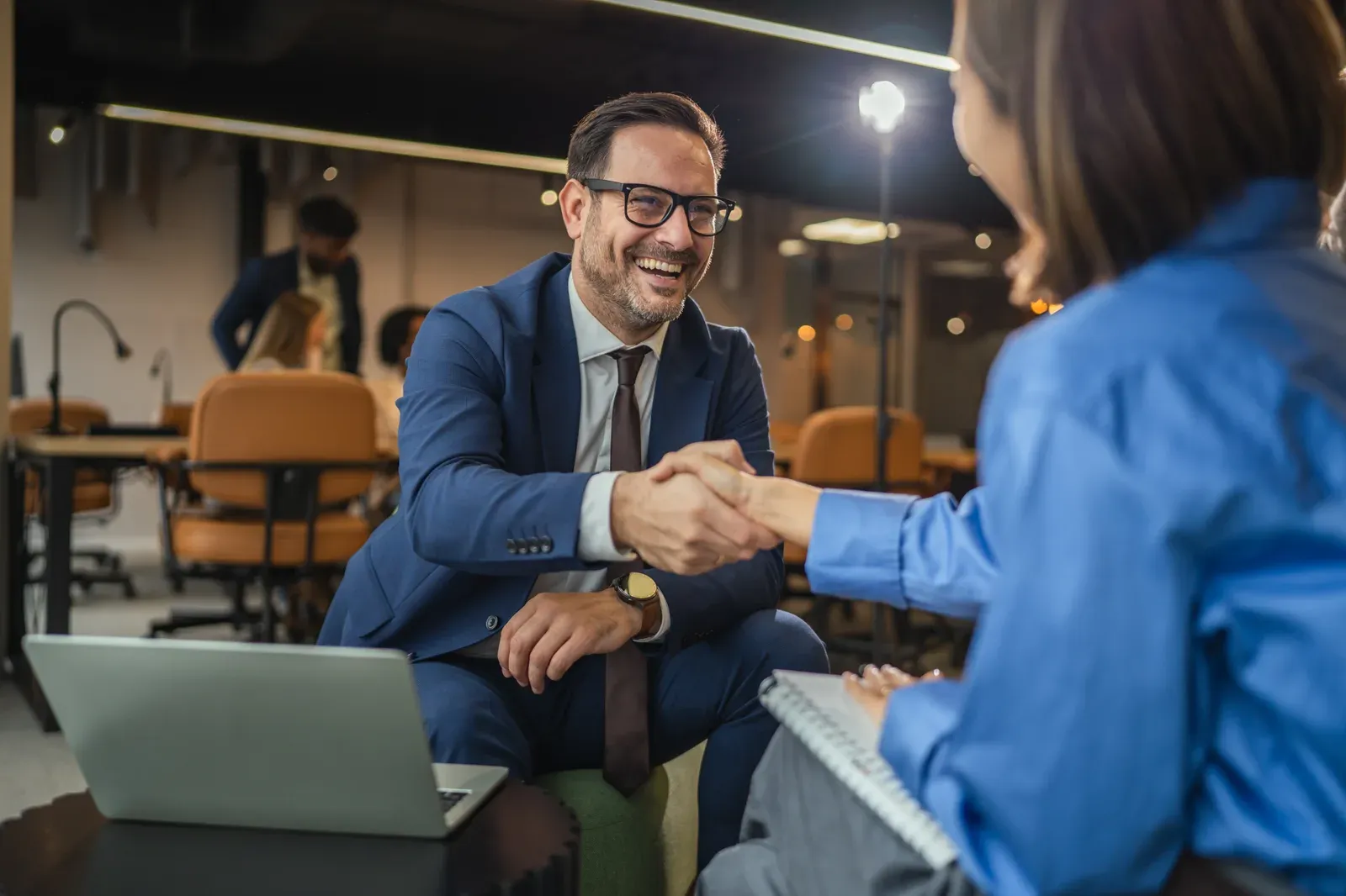 Handshake between professionals sealing an agreement in an office