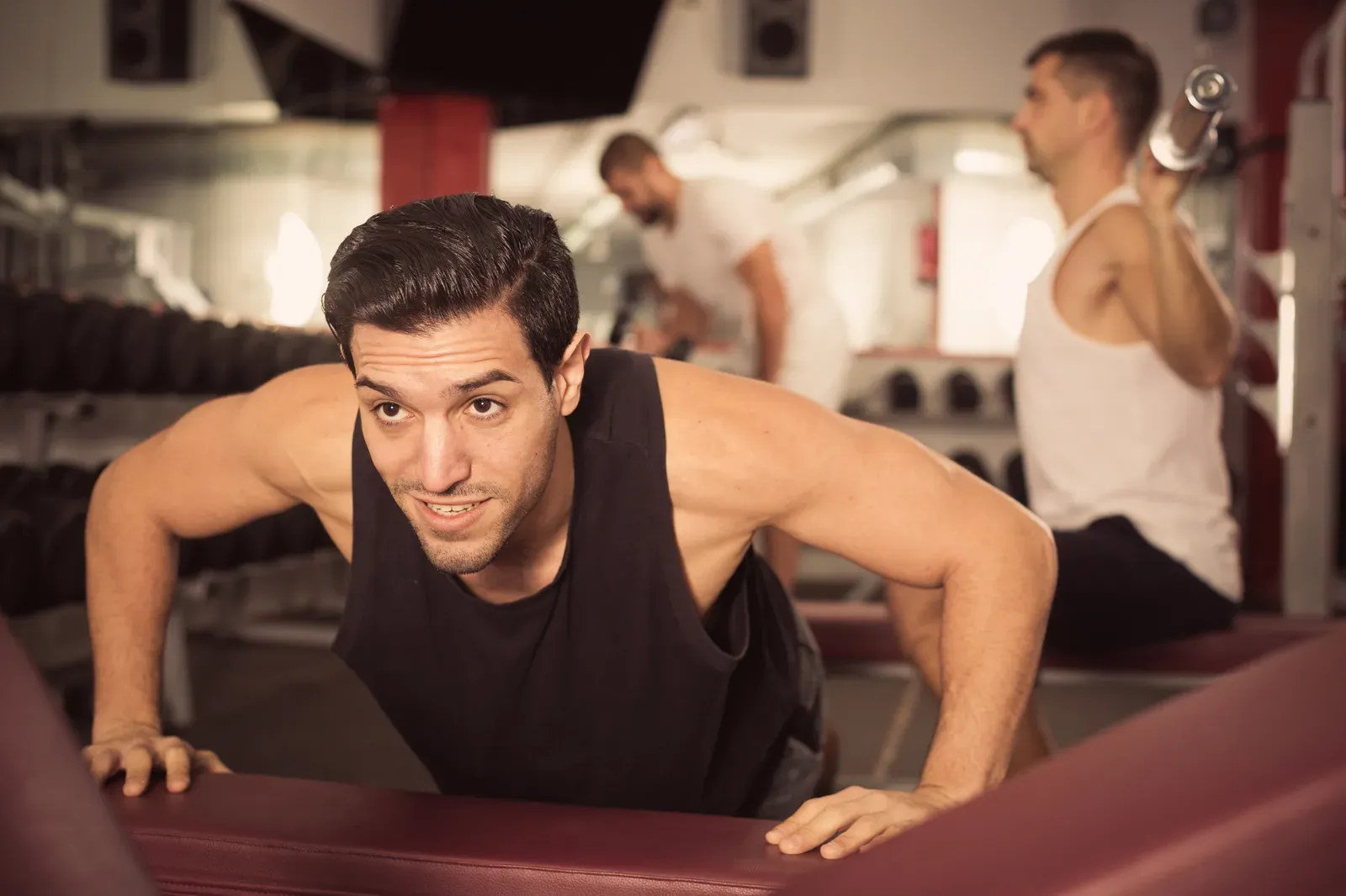 Man performing push-ups during training, the movement a toes-down first push-up builds toward