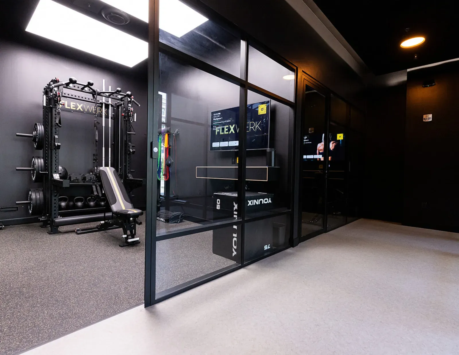 Glass doors opening into a private FlexSpace training room at FlexWerk Carmel City Center
