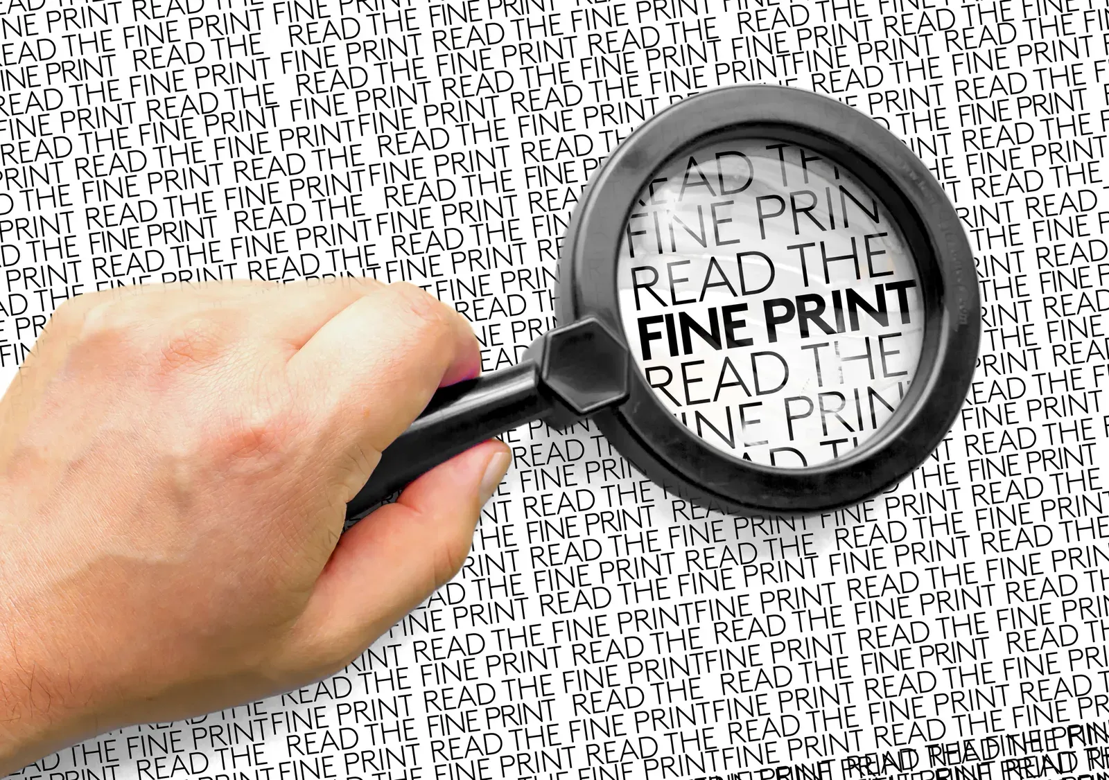 Person with a magnifying glass looking at text reading Read the Fine Print, a prompt to check trial terms