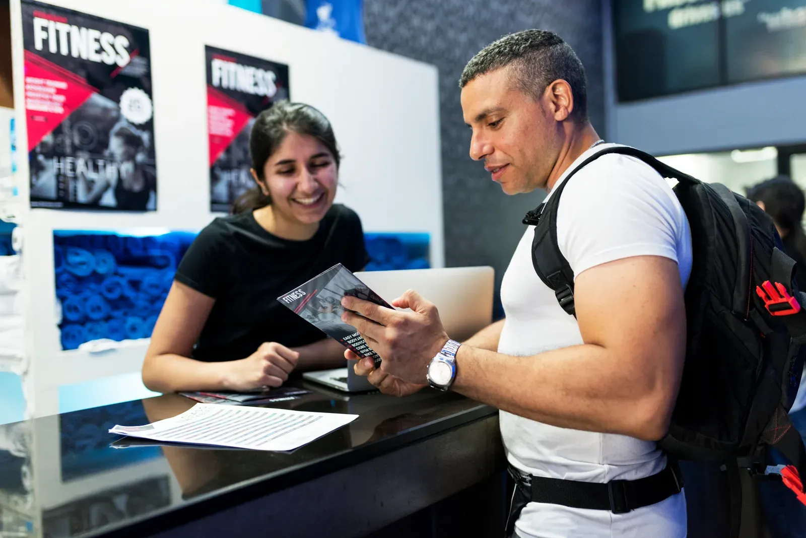 Gym membership paperwork, a reminder to check for fees such as initiation charges before joining