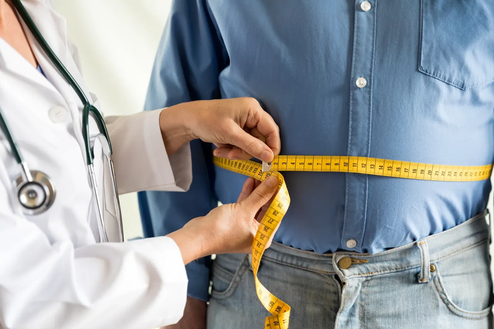 Adult carrying extra body weight, a common starting point for body fat goals