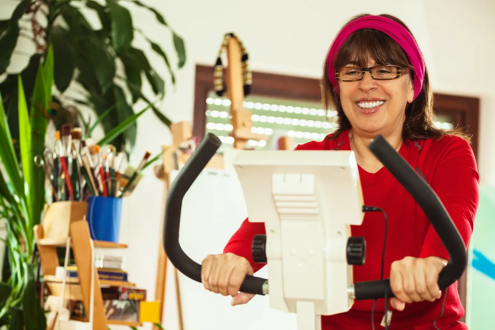 Active mature woman exercising at home, a place to start with a gentle HIIT routine over 50