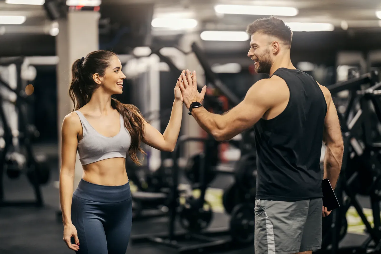 Client and trainer working one on one in a private gym room with no crowd