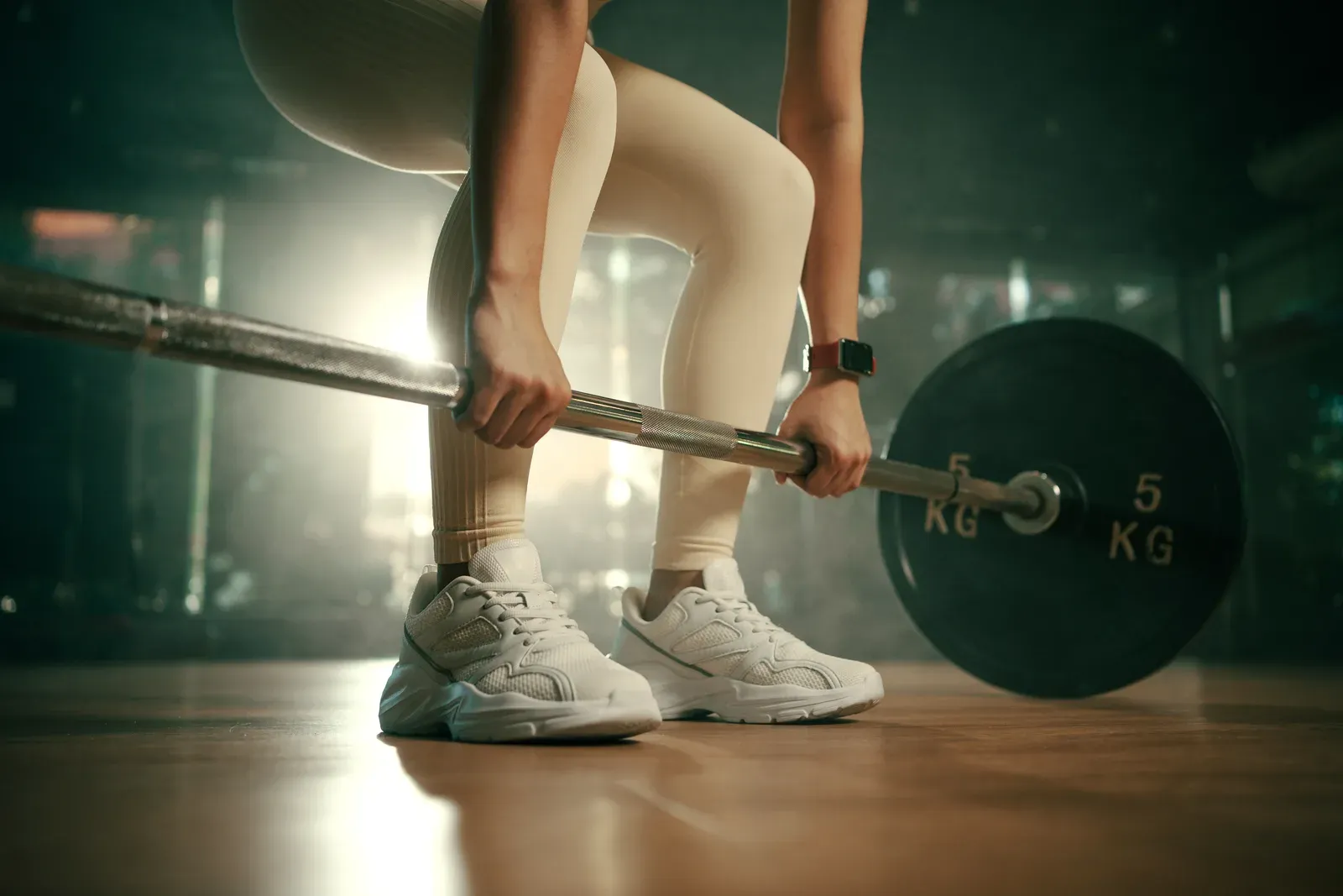 Lifter setting up under a loaded barbell for a heavy back squat