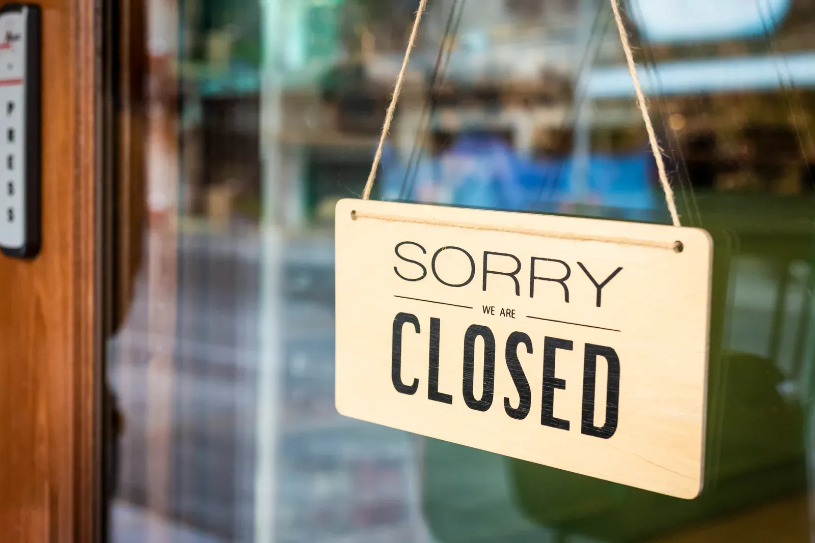 Sorry we are closed sign hanging on a cafe door, a reminder to check prepaid sessions if a studio shuts
