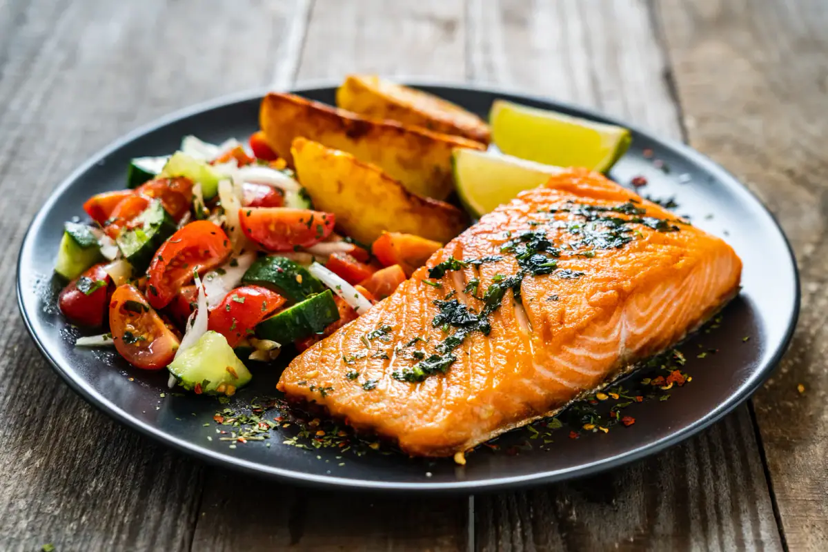 A grilled salmon and vegetable plate, a simple high protein meal