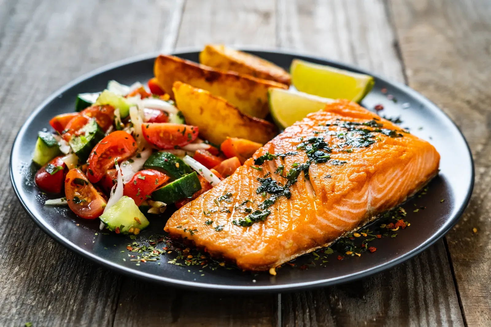 A grilled salmon and vegetable plate, a simple high protein meal