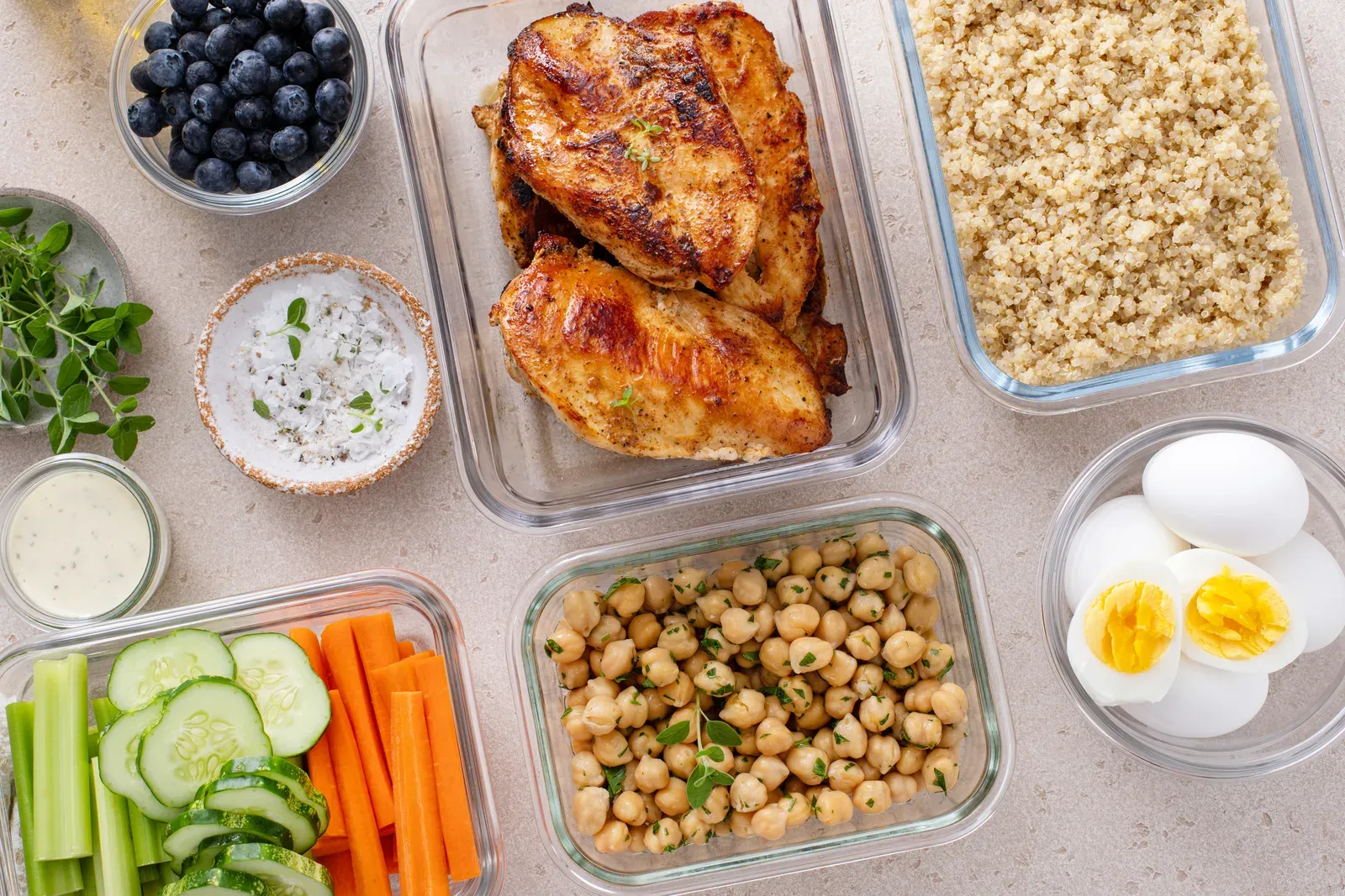 Healthy meal prep containers on a kitchen counter, food planning after a long diet