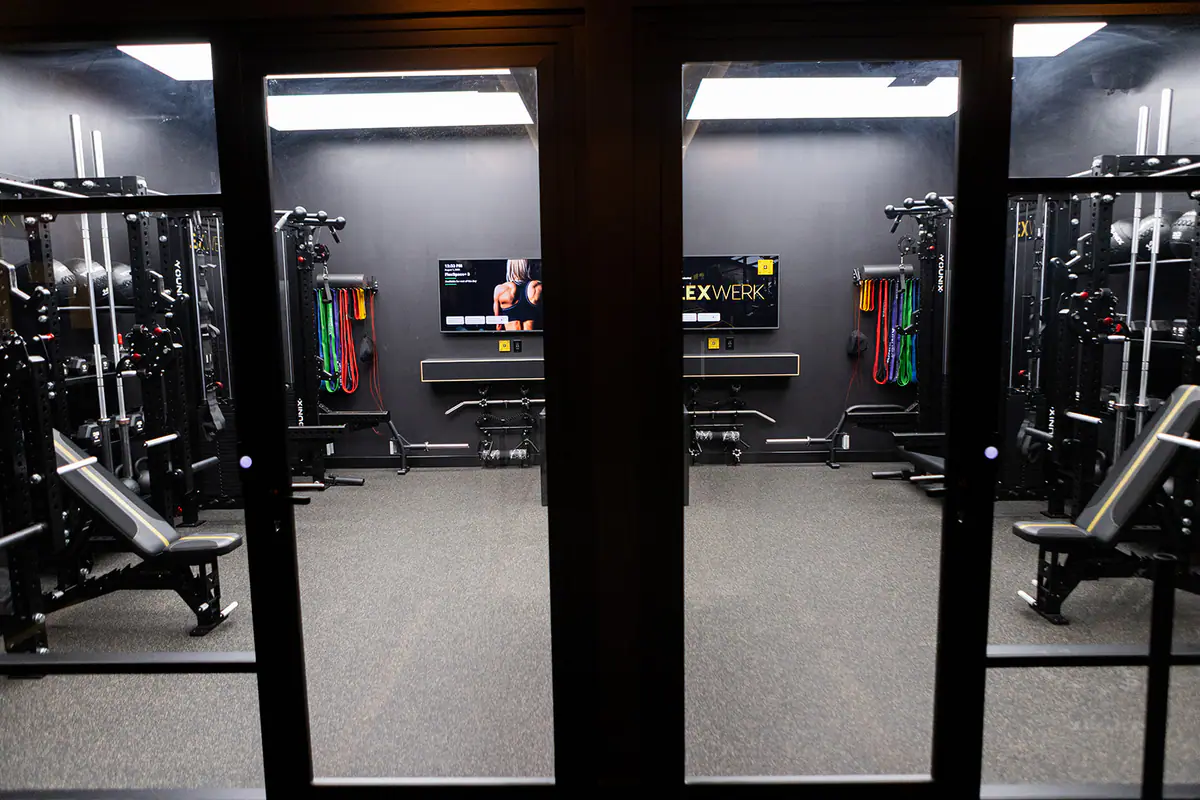 Signature glass suite doors opening into a private FlexSpace at FlexWerk