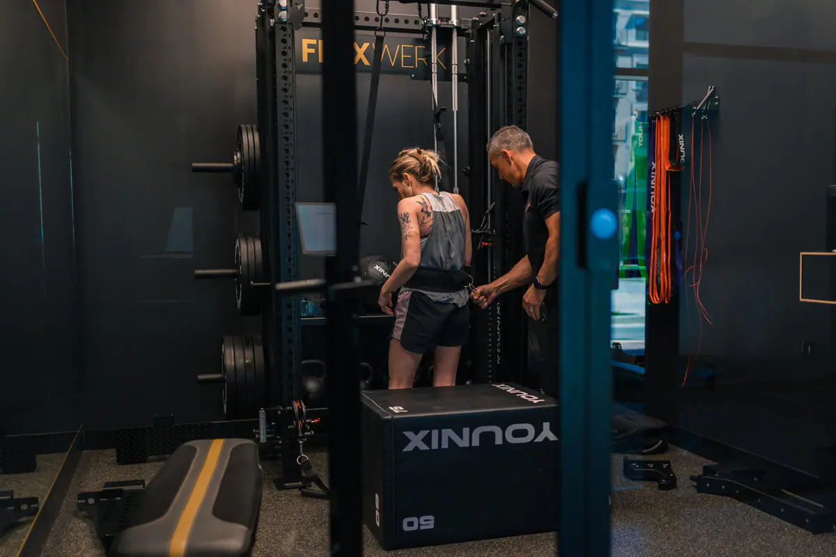 FlexWerk coach working one on one with a client during a private suite session