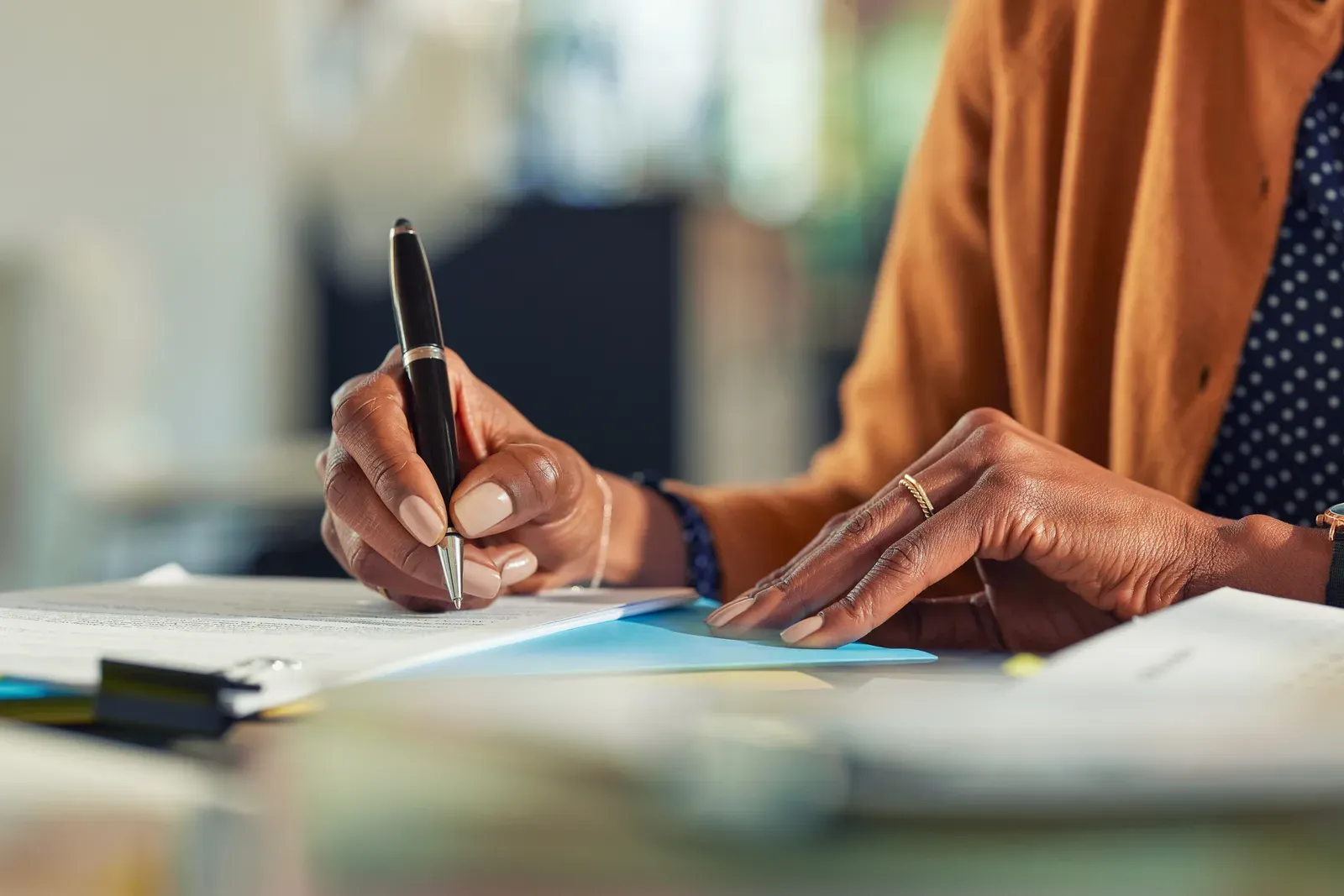 Noting session and package pricing options on paper at a desk