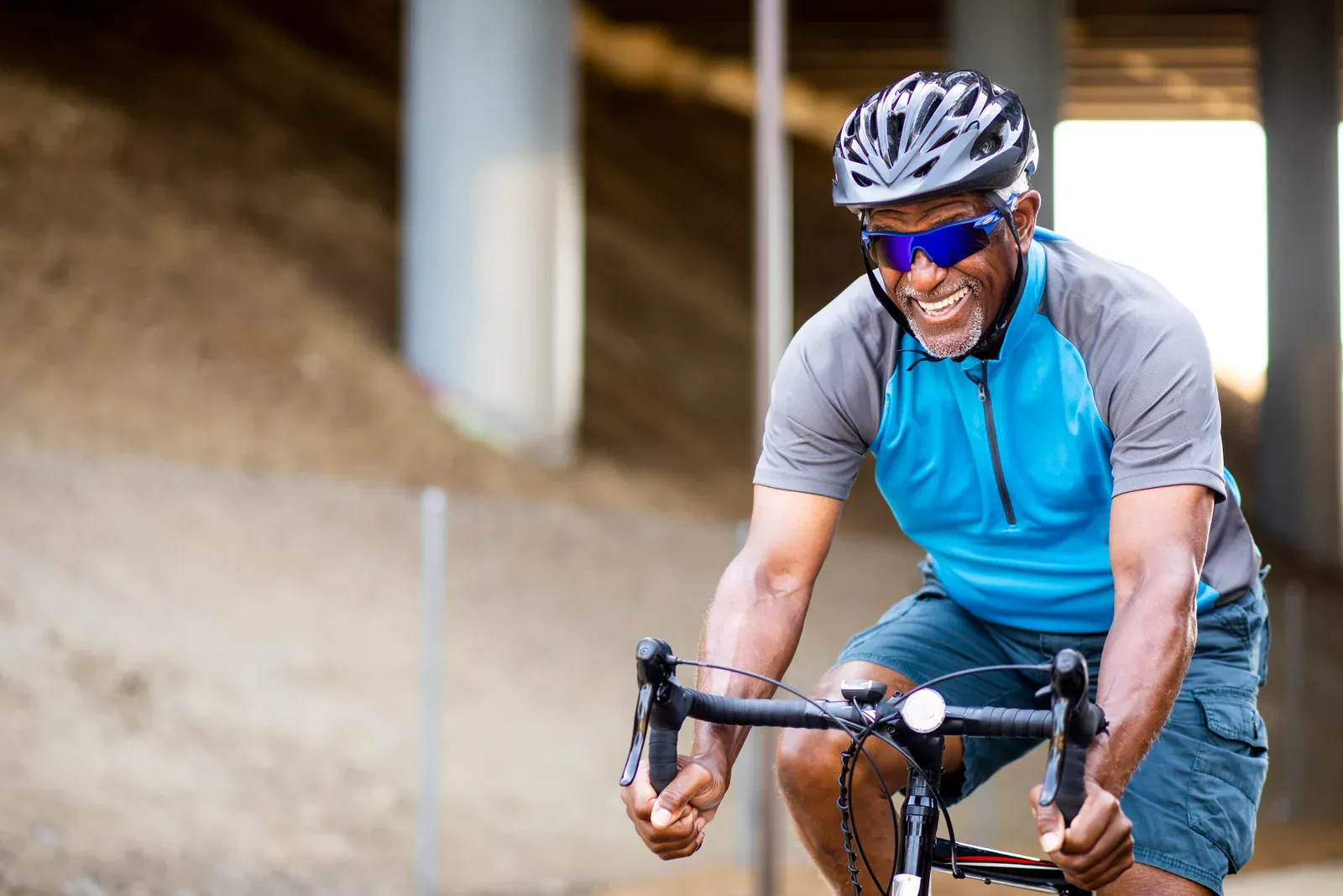A cyclist riding at an easy conversational pace on a quiet road